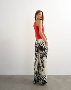 Model wearing Satin feel straight leg trouser in zebra print