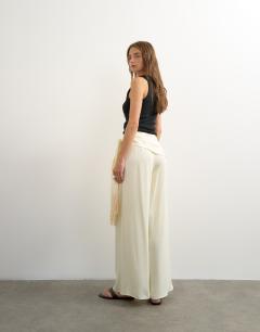 Model wearing Satin feel wrap co-ord trouser with fringe detail in cream