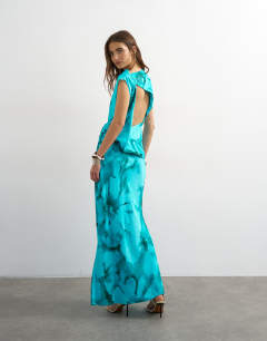 Model wearing Satin grown on neck tuck side maxi dress with open back in aqua floral