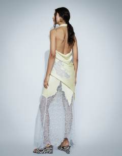 Model wearing Satin halter neck lace hem occasion maxi dress in lime and blue