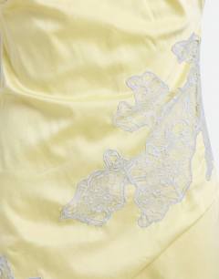 Model wearing Satin halter neck lace hem occasion maxi dress in lime and blue