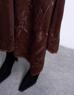 Model wearing Satin hanky hem midi skirt with lace embroidery in chocolate