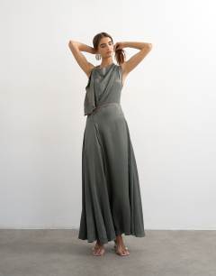 Model wearing Satin high cowl neck asymmetric maxi dress with peach contrast trim in petrol