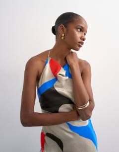 Model wearing Satin high neck cowl maxi dress in bold abstract