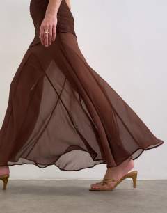 Model wearing Satin high neck pleated dropped waist maxi dress in chocolate