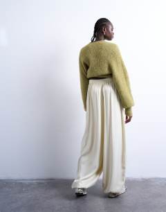 Model wearing Satin high waisted balloon hem trousers in oyster