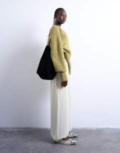 Model wearing Satin high waisted balloon hem trousers in oyster