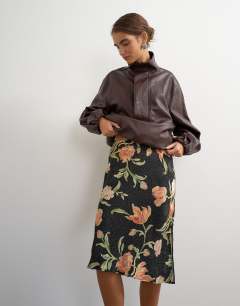 Model wearing Satin jacquard 90s length skirt in spot floral print