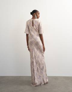 Model wearing Satin jacquard slash neck maxi dress in blue square print