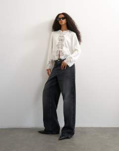 Model wearing Satin lace applique blouse in ivory