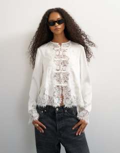 Model wearing Satin lace applique blouse in ivory