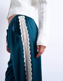 Model wearing Satin lace insert trouser in mid blue