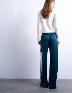 Model wearing Satin lace insert trouser in mid blue