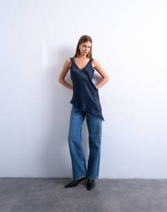 Model wearing Satin lace insert tunic top in navy