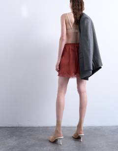 Model wearing Satin lace petticoat mini skirt in chutney