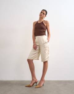 Model wearing Satin longline cargo short in ecru