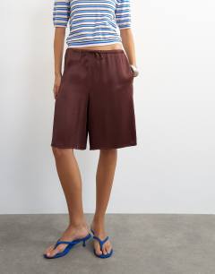 Model wearing Satin longline shorts in chocolate