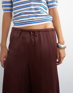 Model wearing Satin longline shorts in chocolate