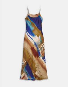 Model wearing Satin low scoop flood length slip dress in abstract ochre print