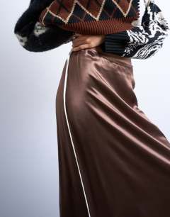 Model wearing Satin maxi bias skirt with piping in chocolate