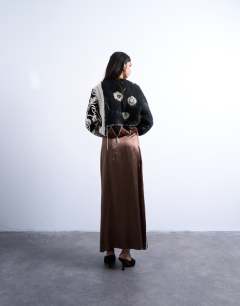 Model wearing Satin maxi bias skirt with piping in chocolate