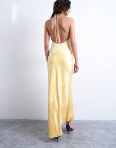 Model wearing Satin maxi occasion halter dress in yellow gradient