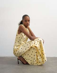 Model wearing Satin polka dot ruched tie shoulder maxi dress in yellow