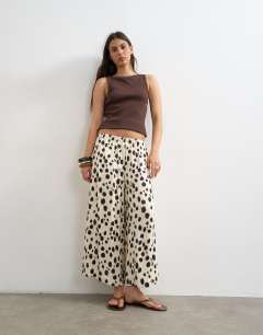 Model wearing Satin pull on A-line wide leg trouser in abstract animal