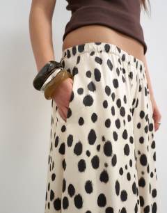 Model wearing Satin pull on A-line wide leg trouser in abstract animal