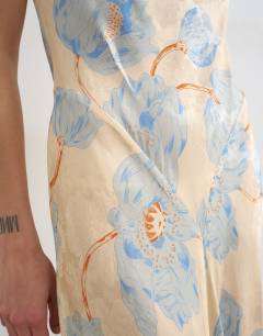 Model wearing Satin racer neck midi dress in blue floral jacquard