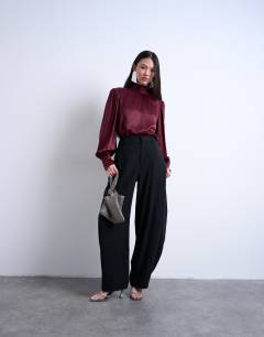 Model wearing Satin scarf blouse in burgundy