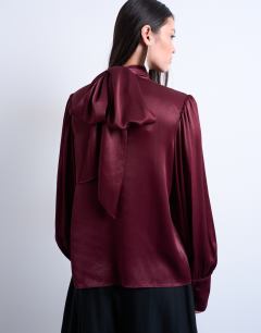 Model wearing Satin scarf blouse in burgundy