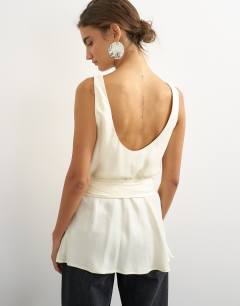 Model wearing Satin scoop neck cami with fringe detail tie in ivory