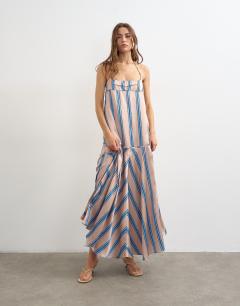 Model wearing Satin seamed maxi dress with piped edges in natural and blue stripe