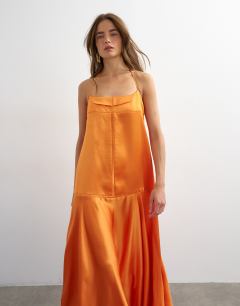 Model wearing Satin seamed maxi dress with piped edges in russet orange