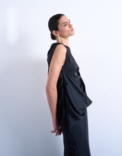 Model wearing Satin slash neck draped cowl front maxi in black