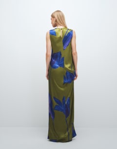 Model wearing Satin sleeveless asymmetric drape maxi dress in green and blue floral
