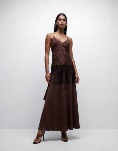 Model wearing Satin strappy maxi dress with jacquard embroidery and fringing in chocolate