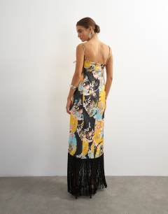 Model wearing Satin strappy square neck maxi dress with fringed hem in black based floral print