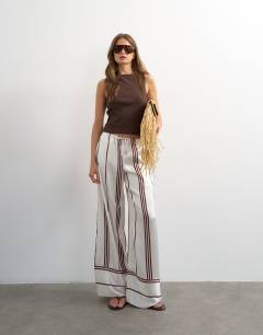 Model wearing Satin stripe tie waist wide leg trouser co-ord in ivory and chocolate