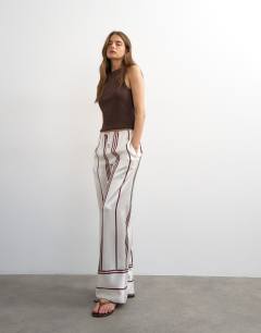 Model wearing Satin stripe tie waist wide leg trouser co-ord in ivory and chocolate
