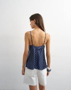 Model wearing Satin striped cami top in navy