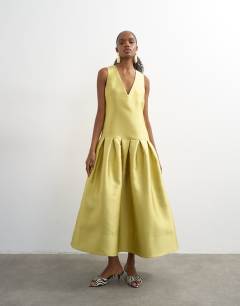 Model wearing Satin structured dropped waist maxi dress in washed lime