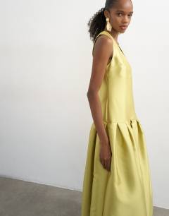 Model wearing Satin structured dropped waist maxi dress in washed lime