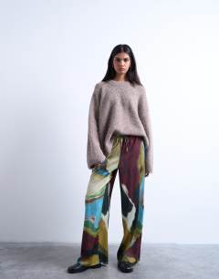Model wearing Satin tie waist wide leg trouser in abstract print