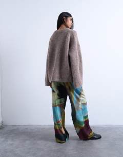 Model wearing Satin tie waist wide leg trouser in abstract print