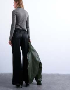 Model wearing Satin tie waist wide leg trouser in black