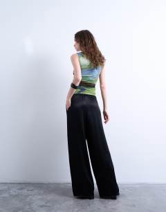 Model wearing Satin tie waist wide leg trouser in black