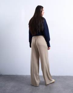 Model wearing Satin tie waist wide leg trouser in champagne