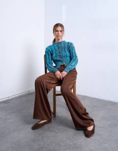 Model wearing Satin tie waist wide leg trouser in chocolate